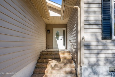 Welcome to 309 Channel Run, a stunning 3-bedroom, 2-bath home on River Bend Golf and Country Club in North Carolina - for sale on GolfHomes.com, golf home, golf lot