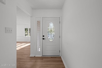 Welcome to 309 Channel Run, a stunning 3-bedroom, 2-bath home on River Bend Golf and Country Club in North Carolina - for sale on GolfHomes.com, golf home, golf lot