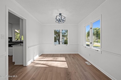 Welcome to 309 Channel Run, a stunning 3-bedroom, 2-bath home on River Bend Golf and Country Club in North Carolina - for sale on GolfHomes.com, golf home, golf lot