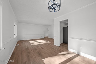 Welcome to 309 Channel Run, a stunning 3-bedroom, 2-bath home on River Bend Golf and Country Club in North Carolina - for sale on GolfHomes.com, golf home, golf lot