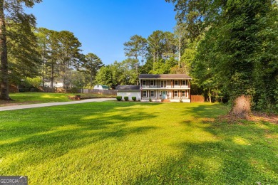Discover this beautifully maintained brick 4-bedroom, 2.5-bath on Canongate At Flat Creek Club in Georgia - for sale on GolfHomes.com, golf home, golf lot