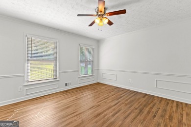 Discover this beautifully maintained brick 4-bedroom, 2.5-bath on Canongate At Flat Creek Club in Georgia - for sale on GolfHomes.com, golf home, golf lot