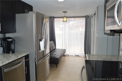 This ground-floor, 1-story, end unit offers plenty of room for on Seasons Ridge At Four Seasons in Missouri - for sale on GolfHomes.com, golf home, golf lot