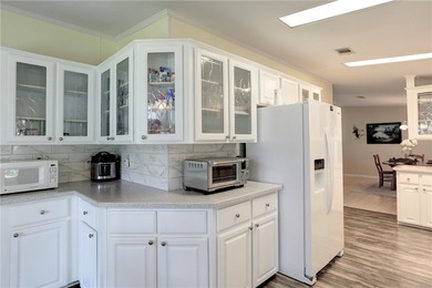 Beautifully maintained home built in 2002, offering over 1,500 on Barefoot Bay Golf Course in Florida - for sale on GolfHomes.com, golf home, golf lot