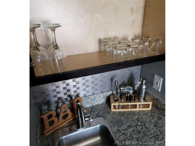 This ground-floor, 1-story, end unit offers plenty of room for on Seasons Ridge At Four Seasons in Missouri - for sale on GolfHomes.com, golf home, golf lot