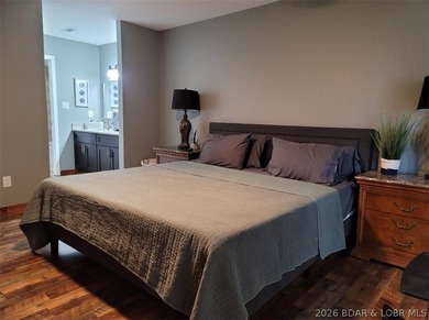 This ground-floor, 1-story, end unit offers plenty of room for on Seasons Ridge At Four Seasons in Missouri - for sale on GolfHomes.com, golf home, golf lot