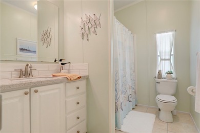 Beautifully maintained home built in 2002, offering over 1,500 on Barefoot Bay Golf Course in Florida - for sale on GolfHomes.com, golf home, golf lot