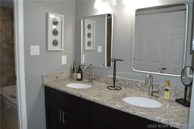 This ground-floor, 1-story, end unit offers plenty of room for on Seasons Ridge At Four Seasons in Missouri - for sale on GolfHomes.com, golf home, golf lot