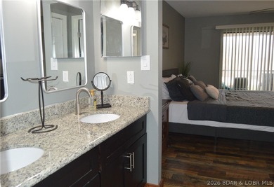 This ground-floor, 1-story, end unit offers plenty of room for on Seasons Ridge At Four Seasons in Missouri - for sale on GolfHomes.com, golf home, golf lot