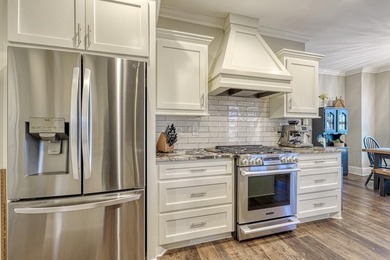 Beautifully designed 4 bedroom/3.5 bathroom home tucked away on on Woodfin Ridge Golf Club in South Carolina - for sale on GolfHomes.com, golf home, golf lot