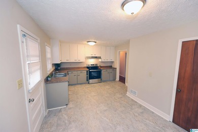 Welcome home! Located within walking distance of the Anniston on Anniston Municipal Golf Course in Alabama - for sale on GolfHomes.com, golf home, golf lot