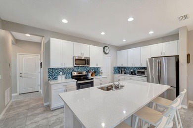 Elegantly maintained and beautifully appointed, this 3-bedroom on The Founders Golf Club in Florida - for sale on GolfHomes.com, golf home, golf lot