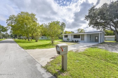 Situated on three lots, this prime Ormond Beach location is just on Riviera Country Club in Florida - for sale on GolfHomes.com, golf home, golf lot