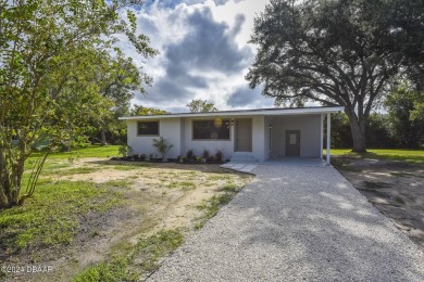 Situated on three lots, this prime Ormond Beach location is just on Riviera Country Club in Florida - for sale on GolfHomes.com, golf home, golf lot