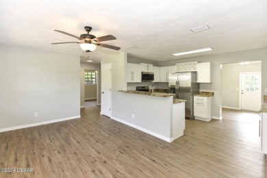 Situated on three lots, this prime Ormond Beach location is just on Riviera Country Club in Florida - for sale on GolfHomes.com, golf home, golf lot