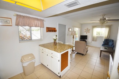 Rarely available ground floor end unit. Easy access to Sharkey's on Lake Venice Golf Club in Florida - for sale on GolfHomes.com, golf home, golf lot