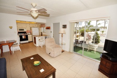 Rarely available ground floor end unit. Easy access to Sharkey's on Lake Venice Golf Club in Florida - for sale on GolfHomes.com, golf home, golf lot