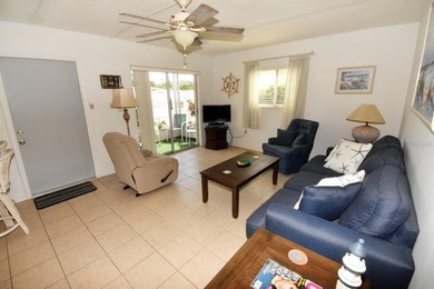 Rarely available ground floor end unit. Easy access to Sharkey's on Lake Venice Golf Club in Florida - for sale on GolfHomes.com, golf home, golf lot