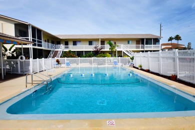 Rarely available ground floor end unit. Easy access to Sharkey's on Lake Venice Golf Club in Florida - for sale on GolfHomes.com, golf home, golf lot