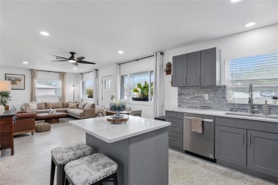 You don't want to miss this stunning, updated corner lot home in on Mangrove Bay Golf Course in Florida - for sale on GolfHomes.com, golf home, golf lot
