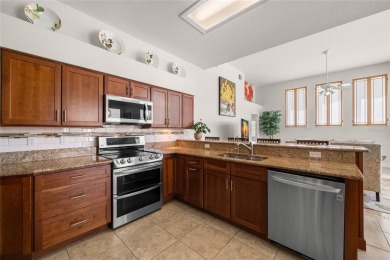 Welcome to this stunning 4-bedroom, 3-bath home featuring a on East Lake Woodlands Country Club in Florida - for sale on GolfHomes.com, golf home, golf lot