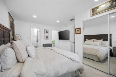 You don't want to miss this stunning, updated corner lot home in on Mangrove Bay Golf Course in Florida - for sale on GolfHomes.com, golf home, golf lot