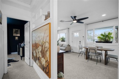 You don't want to miss this stunning, updated corner lot home in on Mangrove Bay Golf Course in Florida - for sale on GolfHomes.com, golf home, golf lot