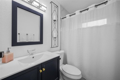 You don't want to miss this stunning, updated corner lot home in on Mangrove Bay Golf Course in Florida - for sale on GolfHomes.com, golf home, golf lot