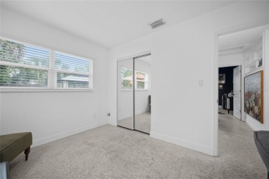 You don't want to miss this stunning, updated corner lot home in on Mangrove Bay Golf Course in Florida - for sale on GolfHomes.com, golf home, golf lot