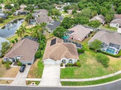 Welcome to this stunning 4-bedroom, 3-bath home featuring a on East Lake Woodlands Country Club in Florida - for sale on GolfHomes.com, golf home, golf lot