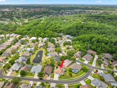 Welcome to this stunning 4-bedroom, 3-bath home featuring a on East Lake Woodlands Country Club in Florida - for sale on GolfHomes.com, golf home, golf lot