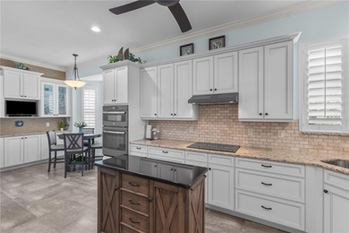 Maintenance-Free Patio Home with Lake View in St. Andrews East on Plantation Golf and Country Club in Florida - for sale on GolfHomes.com, golf home, golf lot