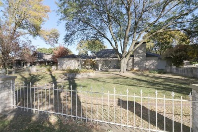 Elegant Brick Ranch Home situated on the Number Six Fairway of on Spencer Golf and Country Club in Iowa - for sale on GolfHomes.com, golf home, golf lot