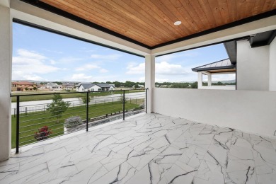 This dream home is nestled within the gated waterfront community on Legends Golf Course in Texas - for sale on GolfHomes.com, golf home, golf lot