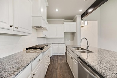 This highly sought-after single-story Altura Aspen floorplan is on Heath Golf and Yacht Club in Texas - for sale on GolfHomes.com, golf home, golf lot