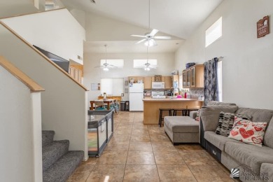 This townhouse boasts two stories, featuring three bedrooms and on Mesa Del Sol Golf Club in Arizona - for sale on GolfHomes.com, golf home, golf lot