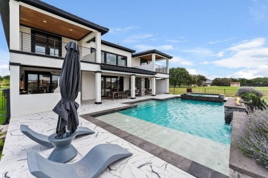 This dream home is nestled within the gated waterfront community on Legends Golf Course in Texas - for sale on GolfHomes.com, golf home, golf lot