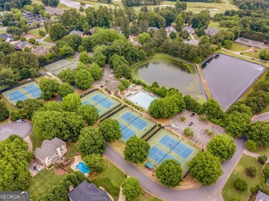 This three-sided brick traditional beauty delivers space, style on Polo Golf and Country Club in Georgia - for sale on GolfHomes.com, golf home, golf lot