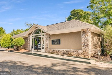 This three-sided brick traditional beauty delivers space, style on Polo Golf and Country Club in Georgia - for sale on GolfHomes.com, golf home, golf lot