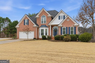 This three-sided brick traditional beauty delivers space, style on Polo Golf and Country Club in Georgia - for sale on GolfHomes.com, golf home, golf lot