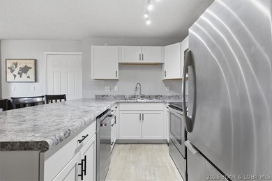 Imagine starting your day with coffee on your private deck as on Seasons Ridge At Four Seasons in Missouri - for sale on GolfHomes.com, golf home, golf lot