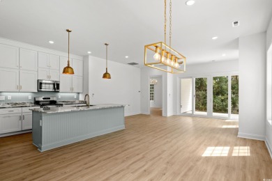 Welcome to this luxurious 4-bedroom, 3.5-bath beach home! on Whispering Pines in South Carolina - for sale on GolfHomes.com, golf home, golf lot