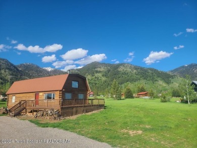 Quaint log cabin living at the base of the Bridger-Teton on Cedar Creek Golf Course in Wyoming - for sale on GolfHomes.com, golf home, golf lot