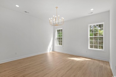 Welcome to this luxurious 4-bedroom, 3.5-bath beach home! on Whispering Pines in South Carolina - for sale on GolfHomes.com, golf home, golf lot