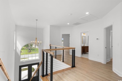 Welcome to this luxurious 4-bedroom, 3.5-bath beach home! on Whispering Pines in South Carolina - for sale on GolfHomes.com, golf home, golf lot