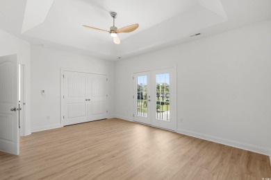Welcome to this luxurious 4-bedroom, 3.5-bath beach home! on Whispering Pines in South Carolina - for sale on GolfHomes.com, golf home, golf lot