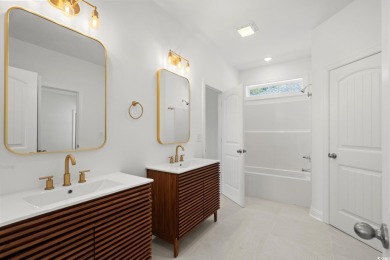 Welcome to this luxurious 4-bedroom, 3.5-bath beach home! on Whispering Pines in South Carolina - for sale on GolfHomes.com, golf home, golf lot
