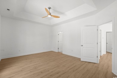 Welcome to this luxurious 4-bedroom, 3.5-bath beach home! on Whispering Pines in South Carolina - for sale on GolfHomes.com, golf home, golf lot