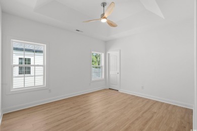 Welcome to this luxurious 4-bedroom, 3.5-bath beach home! on Whispering Pines in South Carolina - for sale on GolfHomes.com, golf home, golf lot