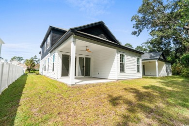 Welcome to this luxurious 4-bedroom, 3.5-bath beach home! on Whispering Pines in South Carolina - for sale on GolfHomes.com, golf home, golf lot